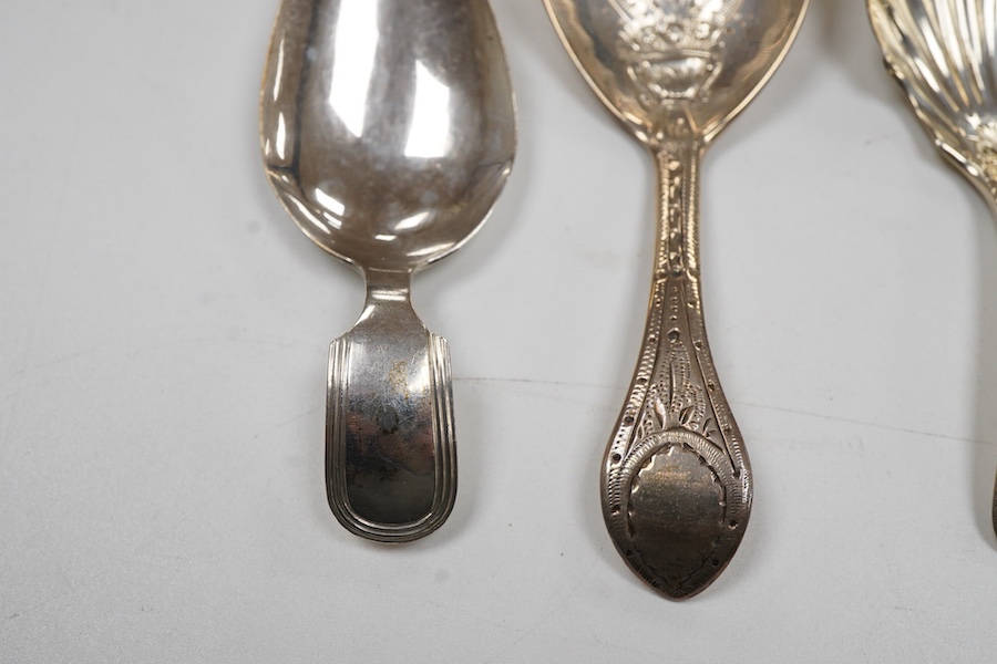 A George IV silver fiddle pattern caddy spoon, the bowl engraved with thistles, James Beebe, London, 1825, 90mm, a Georgian siler caddy spoon, the bowl embossed with urn and flowers, a late Victorian silver caddy spoon w